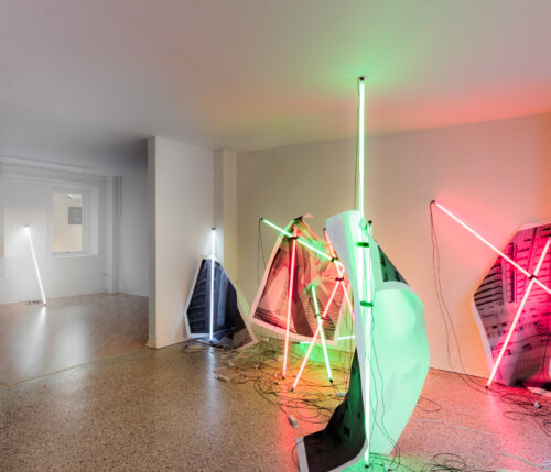 24 Hour Bail Bonds Service, 2020<br> 
B&W photographs<br> 
Coloured T8 fluorescent tubes.<br>